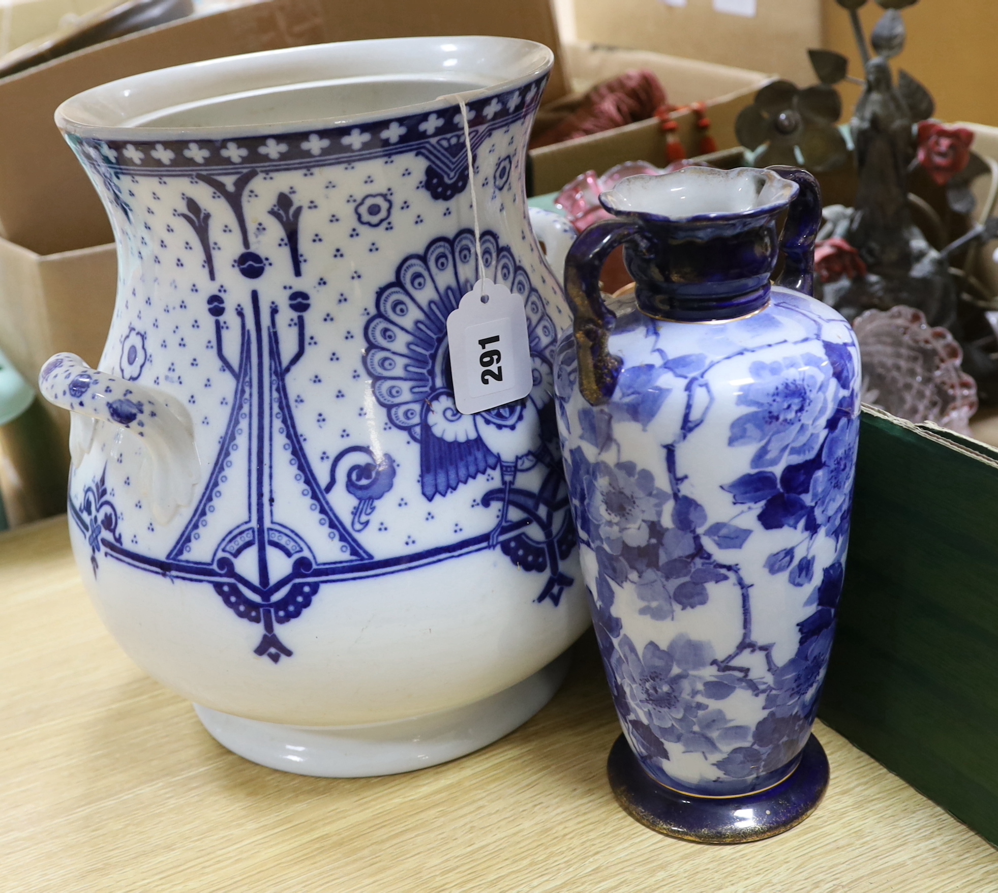 A large Arts and Crafts style two handled blue and white pot, a vase, two jugs, a quantity coloured glass and a table lamp